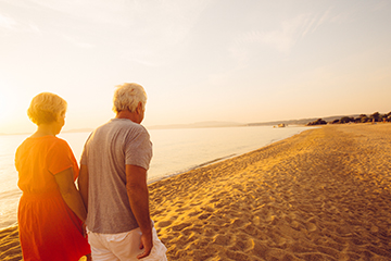 retirement couple on beach - web thumb